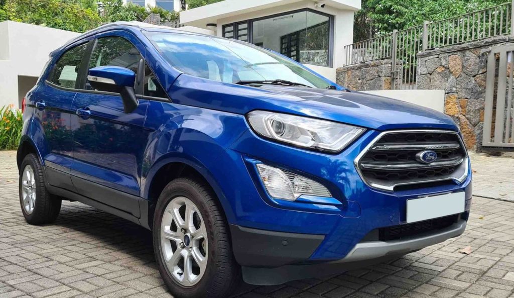 Ford EcoSport Titanium Plus Automatic car rental Port Louis with Caudan Waterfront in background.