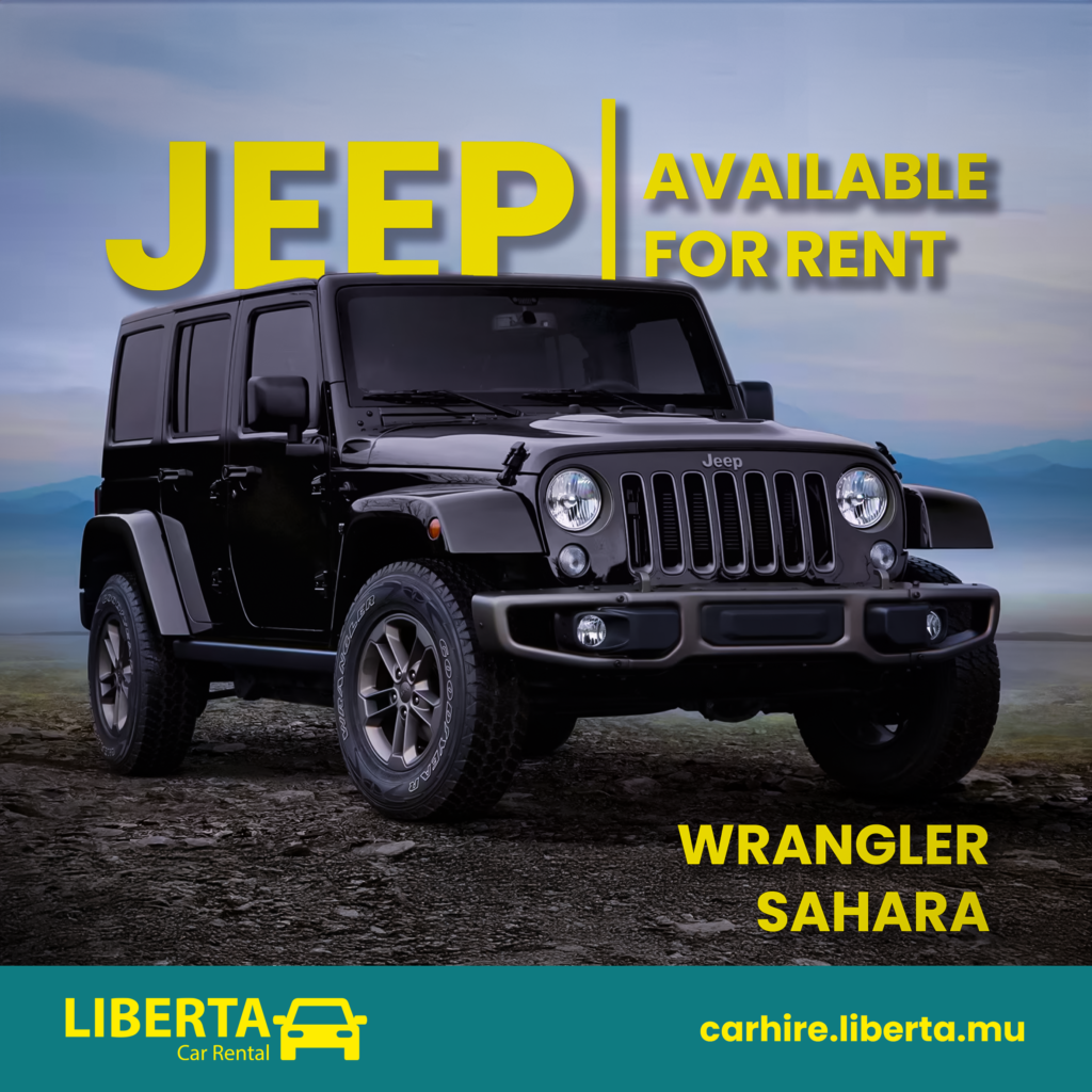The Jeep Wrangler Sahara driving through the rugged landscapes of Mauritius, showcasing its off-road capability and luxurious design, perfect for adventurous travelers.