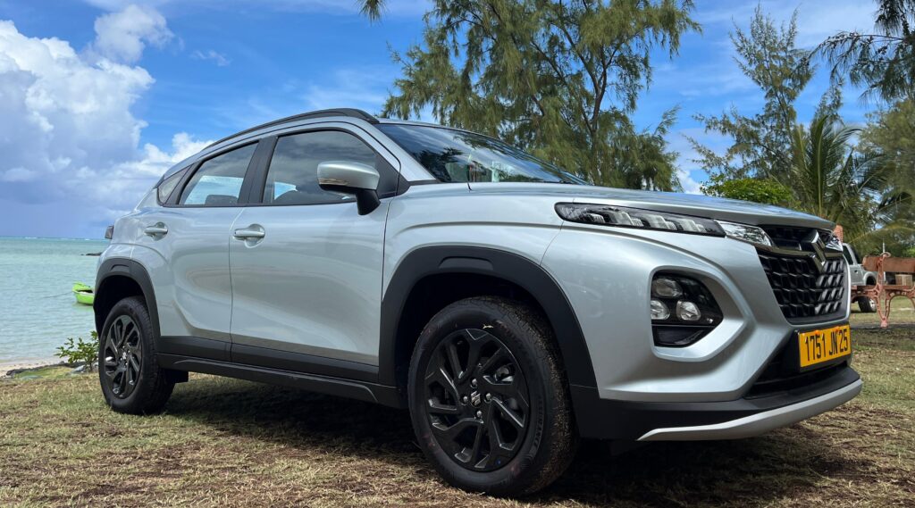 Suzuki Fronx Hybrid - Eco-Friendly Car Hire in Grand Baie, Mauritius Car Hire in Mauritius Suzuki Fronx Hybrid parked in Grand Baie, Mauritius, showcasing modern design and hybrid efficiency