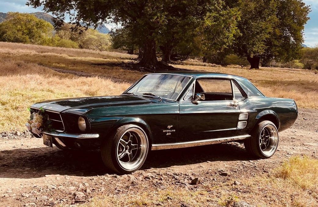 1967 Ford Mustang Coupe in classic red, ideal for a vibrant and stylish wedding getaway