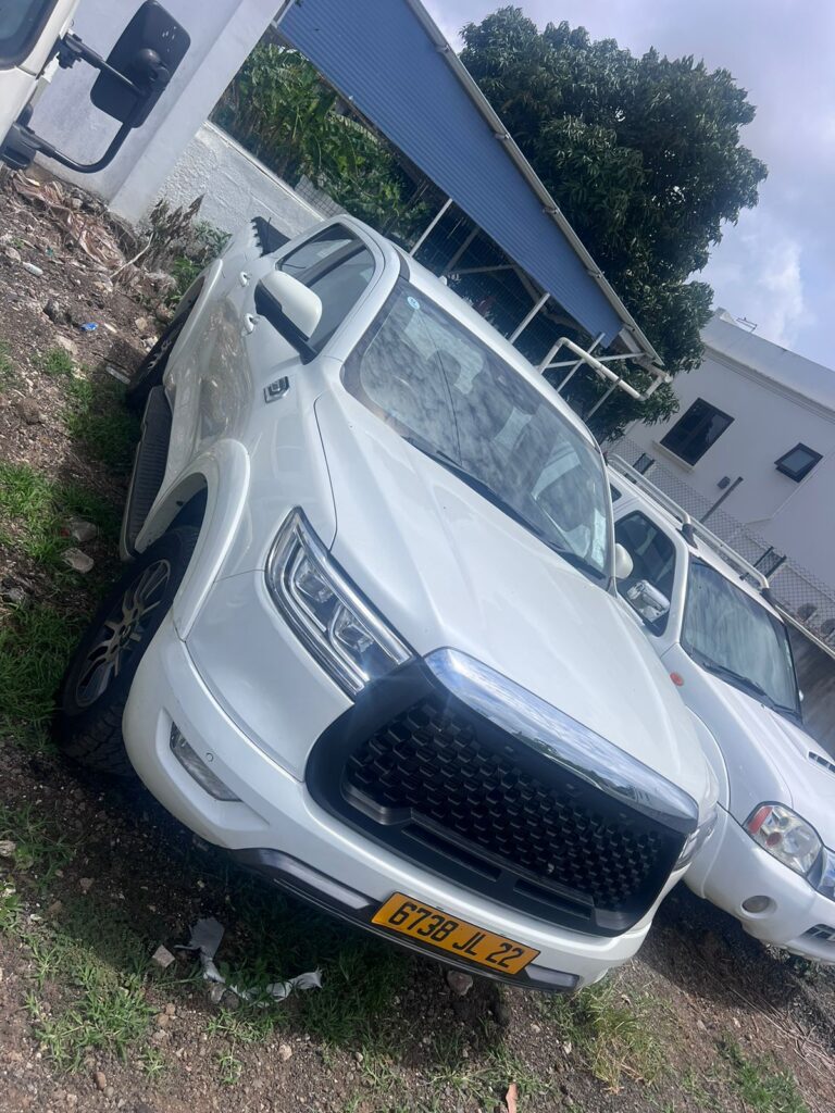 GWM P Series loaded with equipment, parked in a rugged outdoor setting in Mauritius, showcasing its utility and off-road capability as part of Liberta Car Rental's fleet.