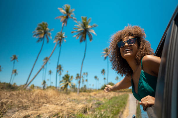 Luxury car parked in front of a picturesque Mauritian hotel, ready for hotel car rental service by Liberta Car Rental.