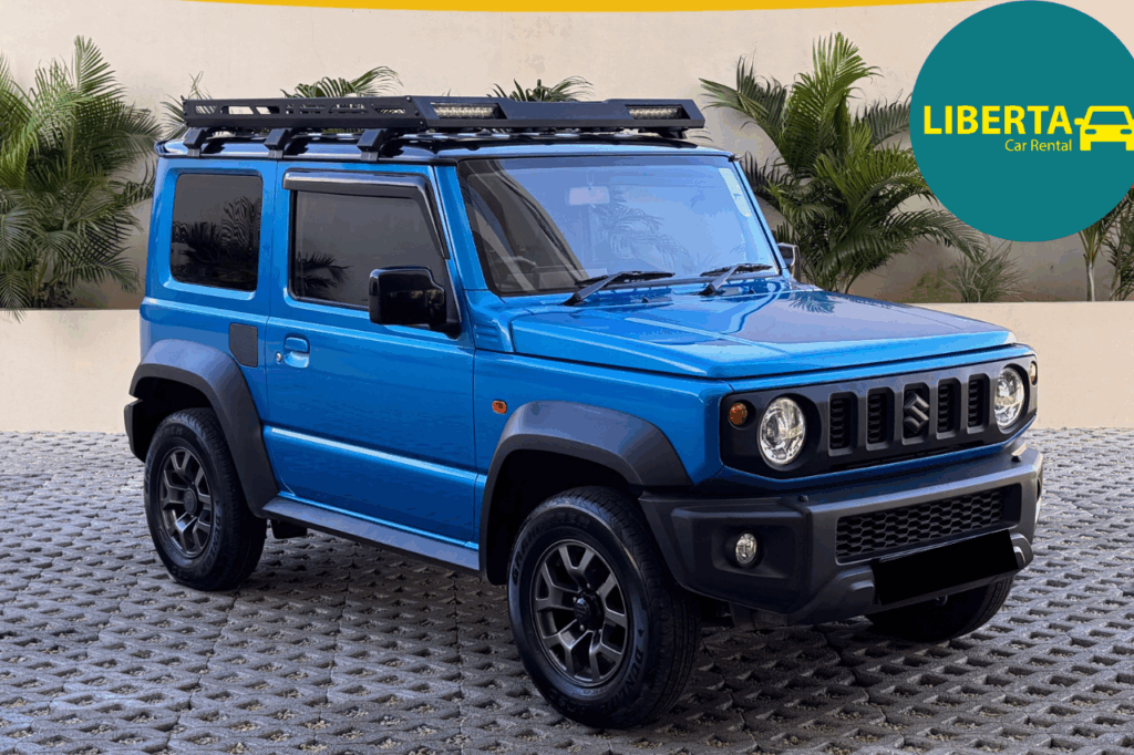 4×4 Suzuki Jimny 3-door manual parked on a Grand Baie beach at sunset
