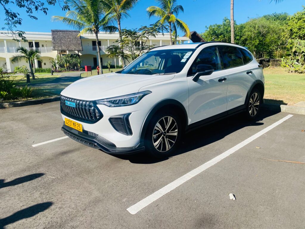 Mauritius rental car 2025 Haval Jolion 1.5L Turbocharged Petrol automatic parked on a scenic Mauritian coastal road